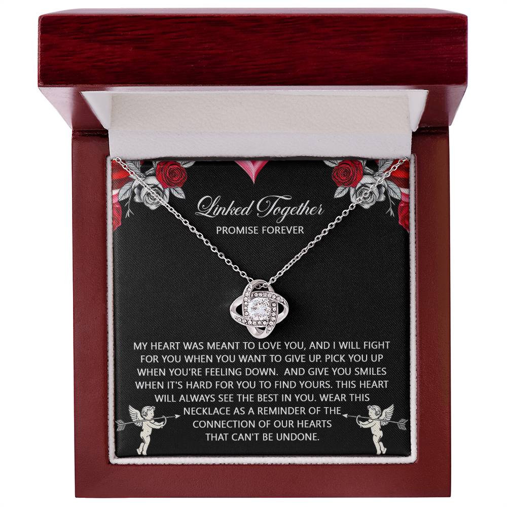 The Love Knot Necklace "Soulmate-To Find Yours" features a planet design, adorned with cubic zirconia crystals, presented in a wooden box. The lid reads "Linked Together, Promise Forever" alongside a sentimental message.