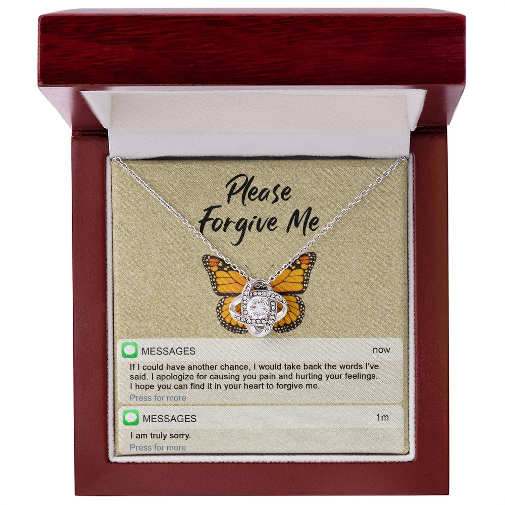 The "Sorry-In Your Heart - Love Knot Necklace" features a butterfly backdrop with cubic zirconia crystals, displayed above a printed message that reads "Please Forgive Me." Below the message, it includes an apology text and a brief follow-up with "I am truly sorry.