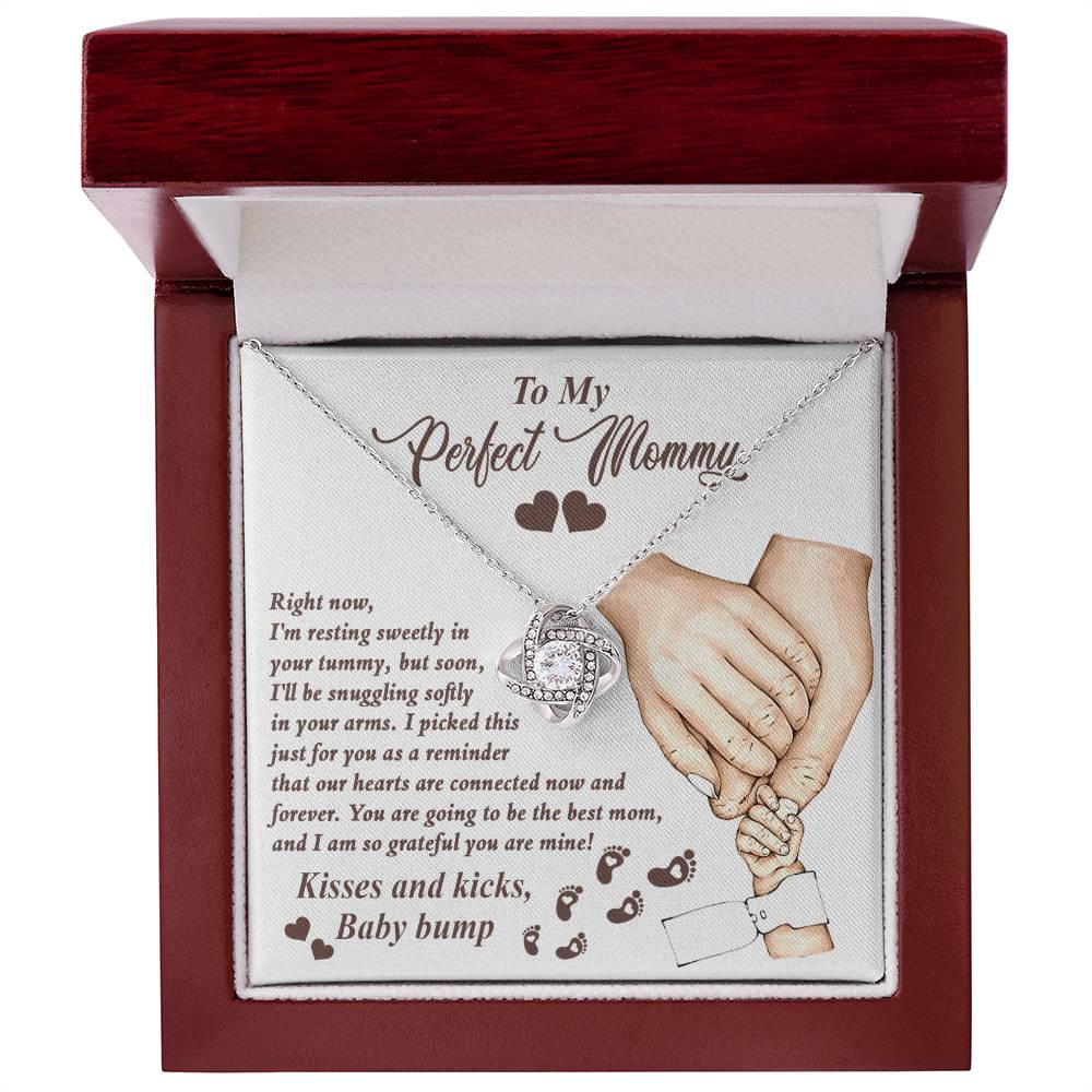 A Personalized Gift box containing a heart-shaped cubic zirconia pendant necklace with an affectionate note for an expectant mother from ShineOn Fulfillment's "To Mama To Be, Now And Forever - Love Knot Necklace.