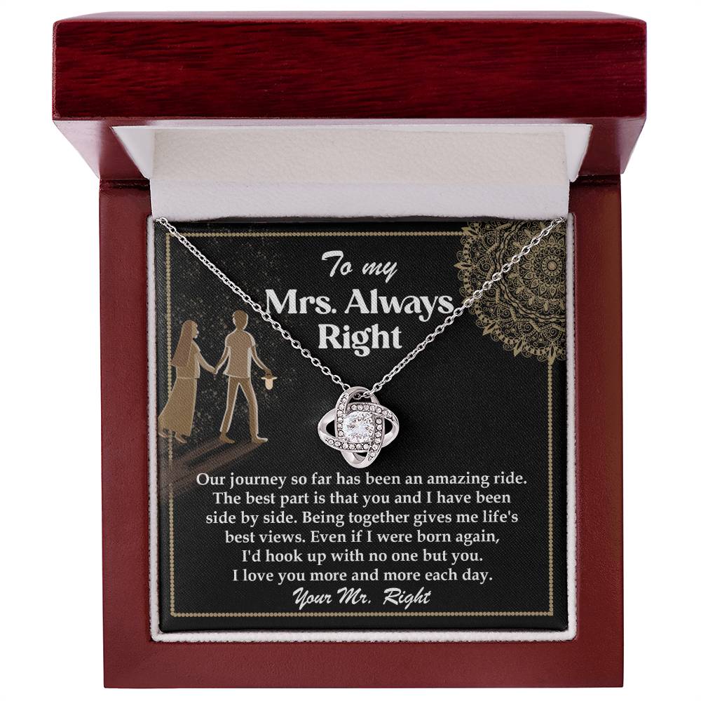 A silver To Wife, Always Right - Love Knot Necklace with an intertwined design, adorned with cubic zirconia crystals, placed on a card that reads: "To my Mrs. Always Right" with a romantic message about love and appreciation.