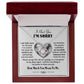 A Sorry-Sincere Apology - Love Knot Necklace displayed in an open jewelry box. The text inside reads an apology message expressing regret and love, with phrases like "I hurt you" and "I'm sorry" alongside sparkling premium cubic zirconia crystals.