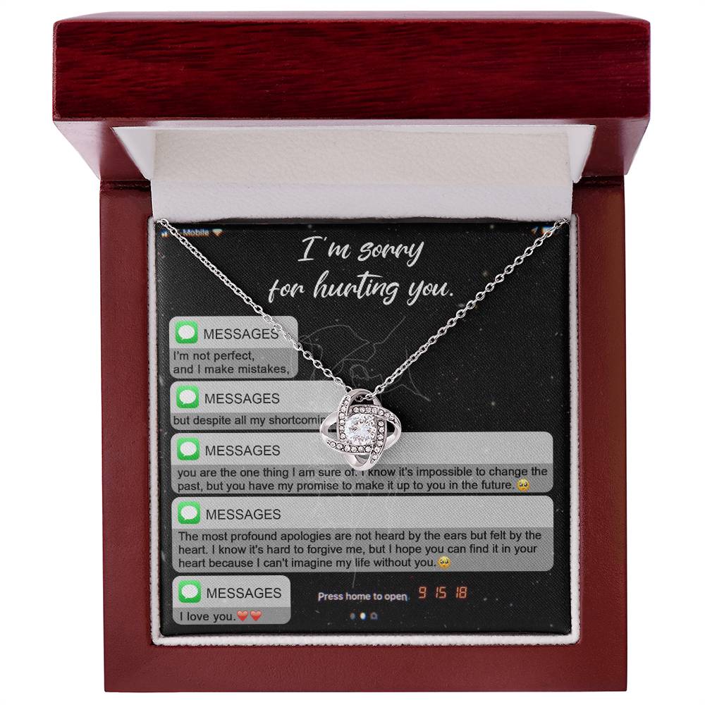 Presenting the "Sorry, Life Without You - Love Knot Necklace," a heartfelt card featuring an emotional message of apology along with a delicate necklace. The love knot design combines intertwined hearts and knots adorned with sparkling cubic zirconia crystals, concluding with the words "I love you." This personalized gift beautifully conveys your genuine emotions.