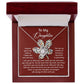 The Daughter-To Be True - Love Knot Necklace, featuring a flower pendant embellished with radiant cubic zirconia crystals, is elegantly displayed inside a wooden jewelry box. The lid of the box is inscribed with a heartfelt message that begins "To My Daughter," making this an ideal gift for someone you cherish.