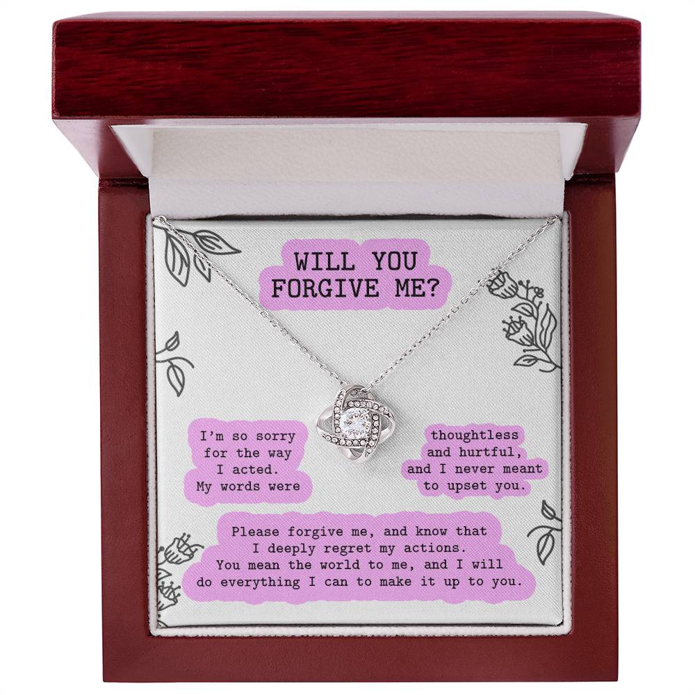 The Sorry-Never Meant To - Love Knot Necklace features a beautiful design with a white gold finish, elegantly presented in a box. It is adorned with sparkling cubic zirconia crystals and comes with an apology message asking, "Will you forgive me?" The heartfelt note expresses deep regret for past actions and makes a promise to make amends.