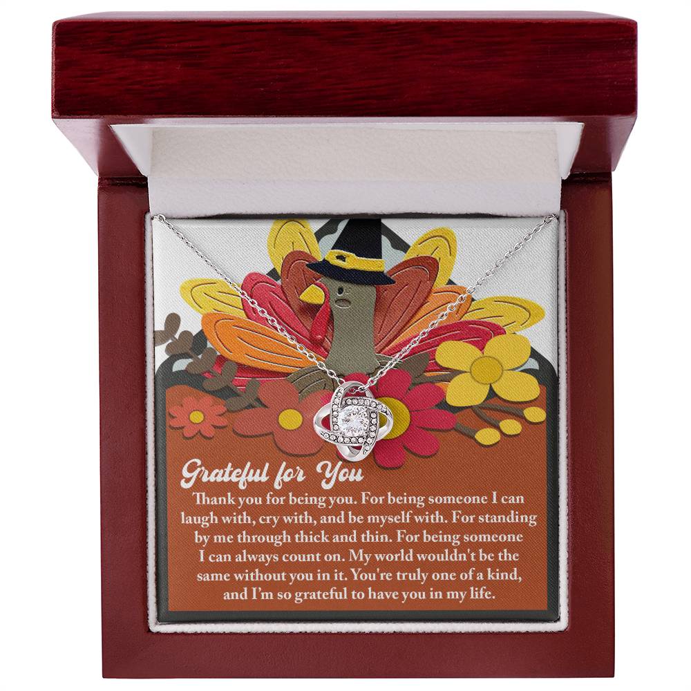 The Thanksgiving-Being You - Love Knot Necklace, embellished with cubic zirconia crystals, is beautifully presented in a red box with a turkey illustration and an appreciation message, making it an ideal personalized gift.