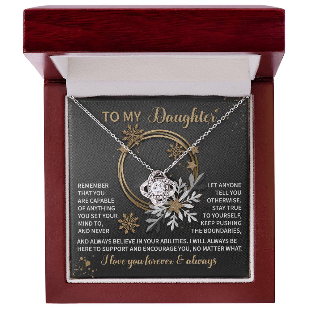 Presented in an open box, the Daughter-Set Your Mind - Love Knot Necklace showcases a shimmering cubic zirconia pendant and includes a heartfelt message card starting with "To My Daughter," providing an inspiring message about love and support. An ideal personalized gift to express how much you care.