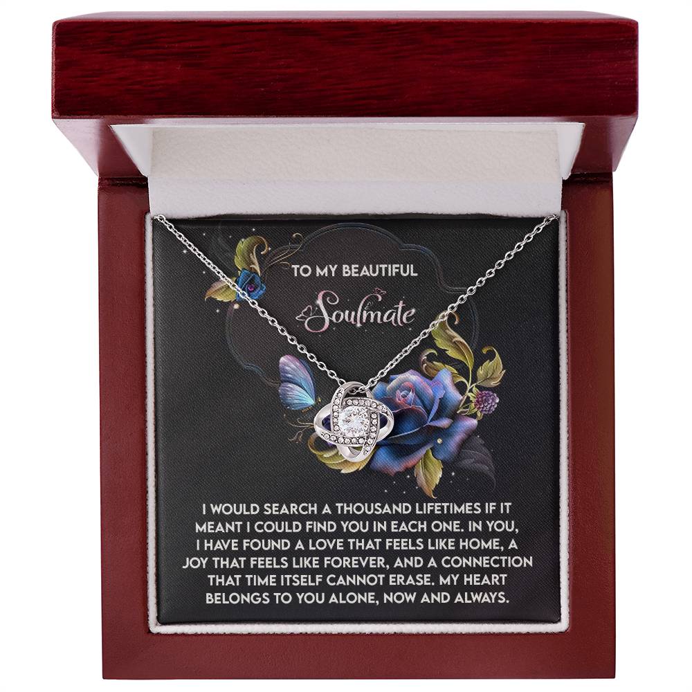 The Soulmate-Like Home Love Knot Necklace features a planet-shaped pendant embellished with cubic zirconia and comes in a jewelry box. The lid reads "To My Beautiful Soulmate" with a heartfelt message, ideal for a personalized gift.