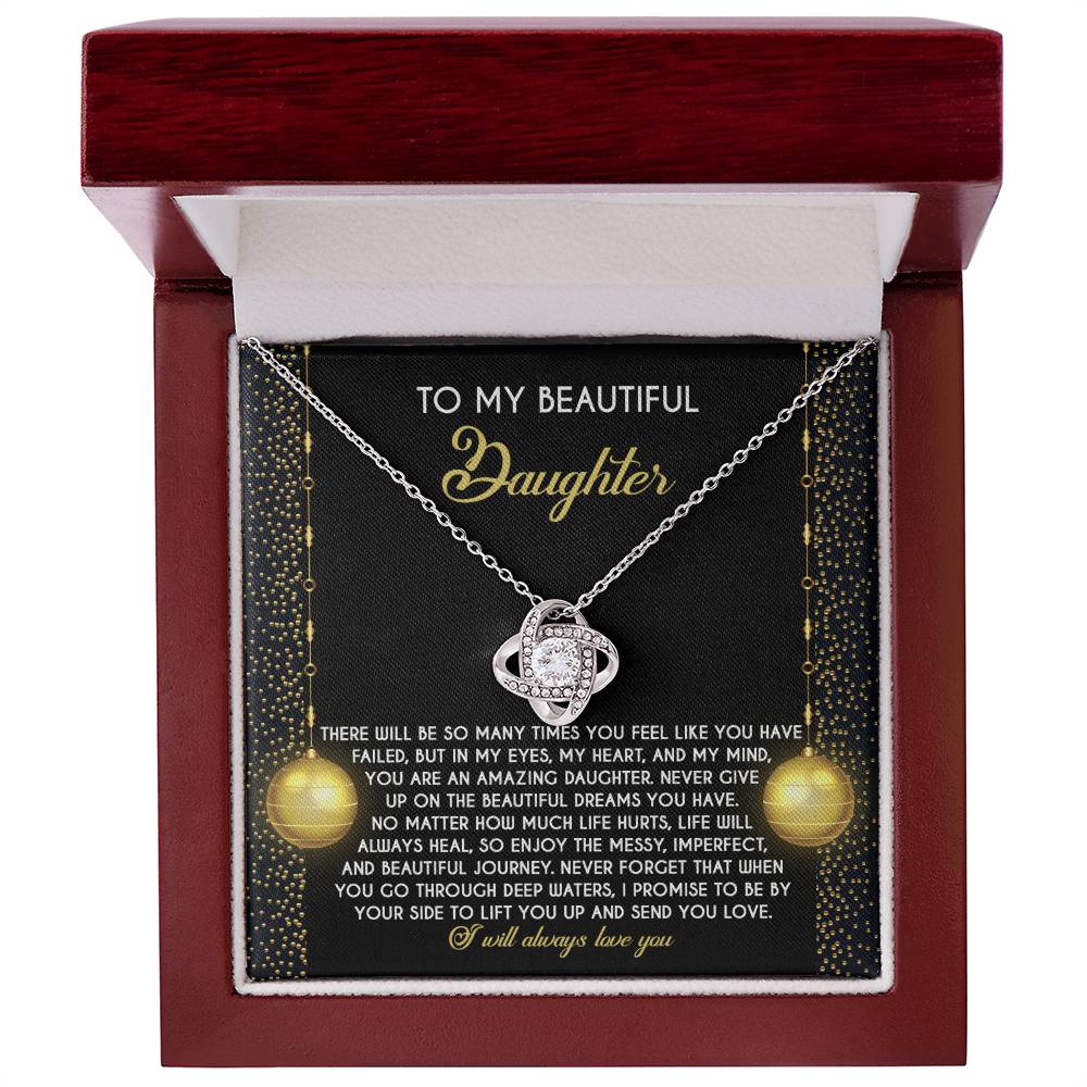 This personalized Daughter-Deep Waters Love Knot Necklace is embellished with sparkling cubic zirconia crystals. It comes in a sophisticated box with a heartfelt message for a daughter, conveying love, encouragement, and an unwavering promise of support.