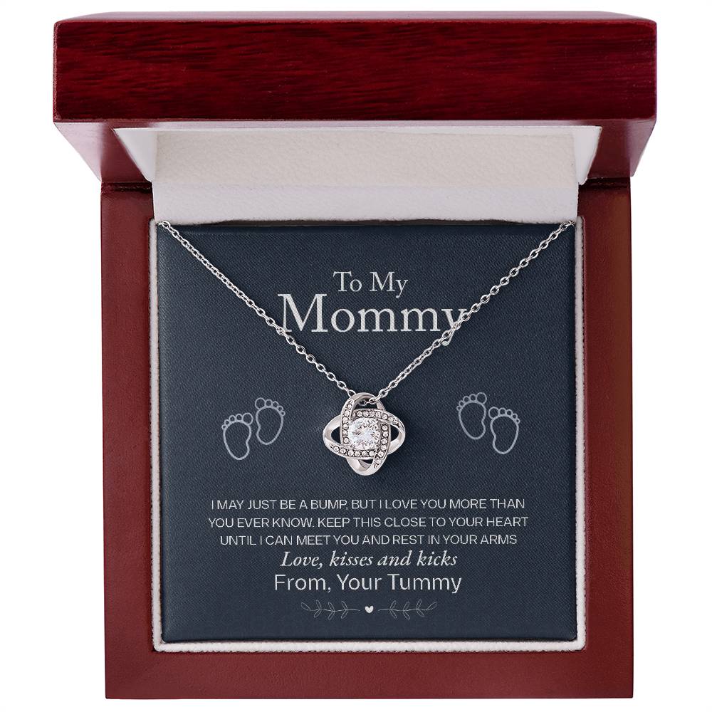 A To My Mommy, Love From Your Tummy - Love Knot Necklace, shaped like a heart with cubic zirconia crystals, encloses a message for an expectant mother inside a jewelry box by ShineOn Fulfillment.