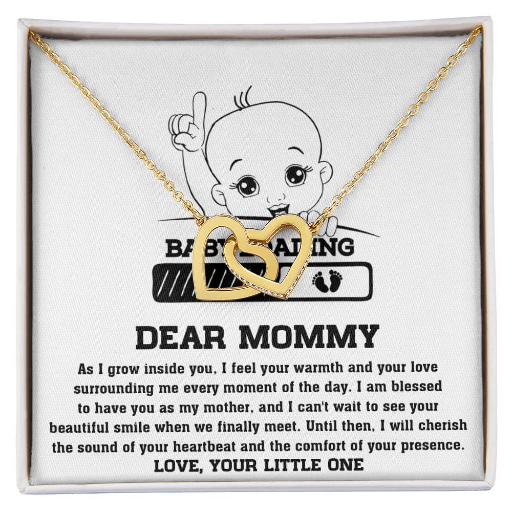 ShineOn Fulfillment's To Mama To Be, Your Little One - Interlocking Hearts Necklace features a pendant with an inscription and illustration for expectant mothers.