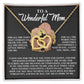 The Mom-More To Me Interlocking Hearts Necklace in rose gold is beautifully presented in a gift box. The lid says "To a Wonderful Mom" with a heartfelt message of gratitude and love for her support, compassion, and presence.