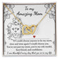 The "To Mom, Be My Mom - Interlocking Hearts Necklace" is presented on a card with a heartfelt message and adorned with shimmering cubic zirconia crystals, featuring floral and heart designs that symbolize endless love and appreciation.