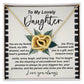 The Daughter-Little Dreamer Interlocking Hearts Necklace features intertwined pendants on a sunflower background, crafted in surgical steel and adorned with cubic zirconia crystals. It includes the message "To My Lovely Daughter," expressing love and appreciation, ending with "Love you always.