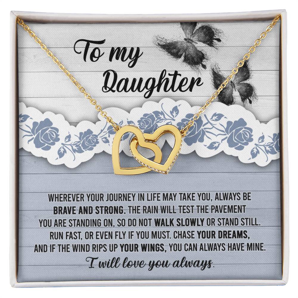 The "To Daughter, Always Have Mine - Interlocking Hearts Necklace," adorned with cubic zirconia crystals, is beautifully presented against a decorative card that inspires bravery, strength, and the pursuit of dreams. The message is addressed "To my Daughter" and concludes with "I will love you always.