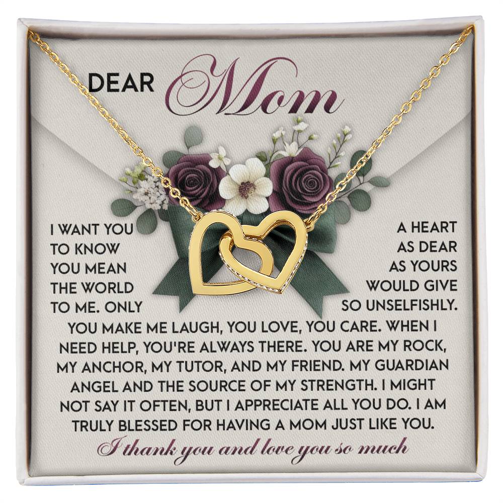 The Mom-Guardian Angel set includes an Interlocking Hearts necklace with cubic zirconia crystals and a decorative card featuring floral accents. The rose gold finish and heartfelt message express gratitude and love for "Mom" and her unwavering support.
