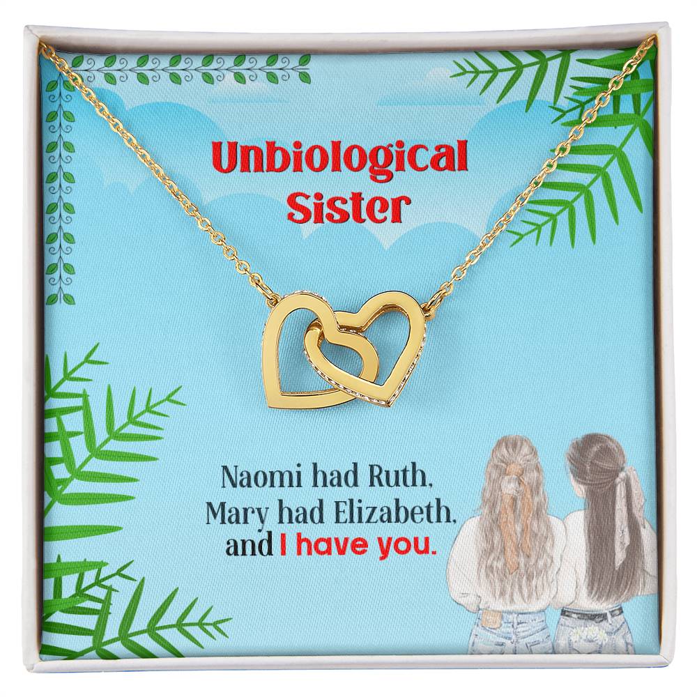 A gift box featuring a To My Unbiological Sister, I Have You - Interlocking Hearts Necklace from ShineOn Fulfillment with the phrase "unbiological sister" and an inspirational quote, accompanied by an illustration of two women embracing.