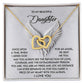The Interlocking Hearts Necklace, from "Daughter-An Angel" collection, features an 18k yellow gold finish and is elegantly displayed on a card with an angel wing illustration. The card conveys a heartfelt message of love, pride, and the enduring parent-child bond.