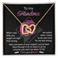 The Grandma-Love For Me Interlocking Hearts Necklace, featuring cubic zirconia crystals and a rose gold finish, is beautifully presented in a box with a heartfelt message for "Grandma." It expresses gratitude and love against a floral backdrop to celebrate lifelong support.