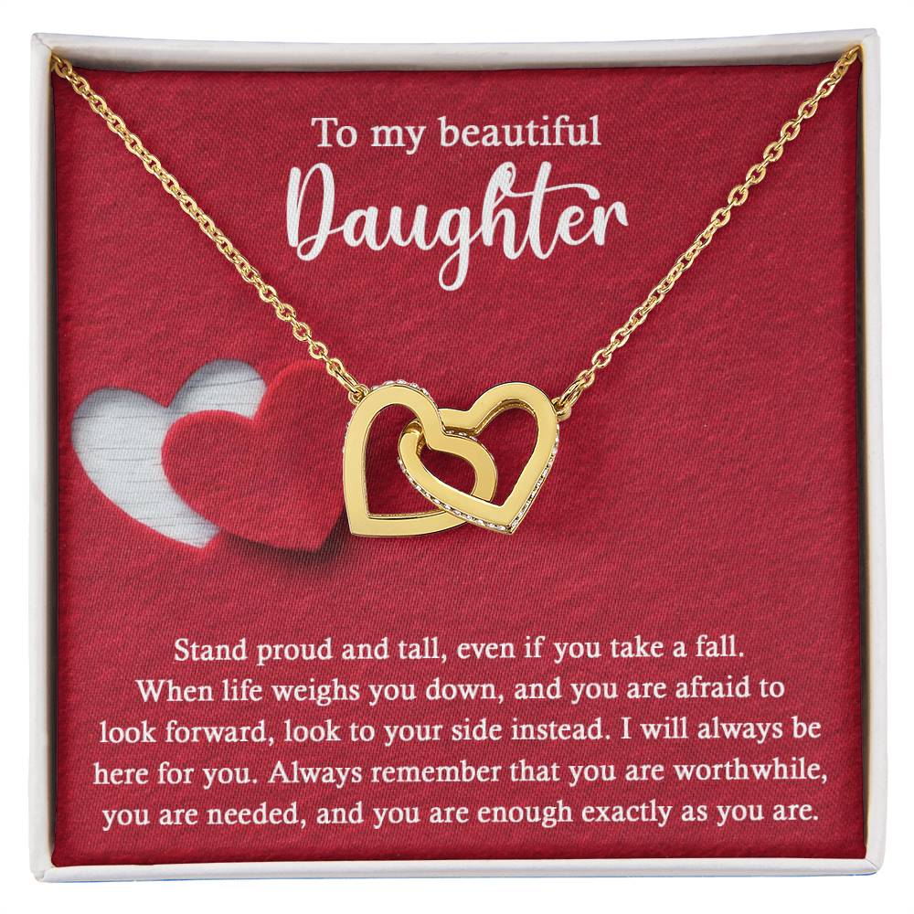 Introducing the elegant "To Daughter, As You Are 2 - Interlocking Hearts Necklace." This stunning piece features two intertwined hearts set against a red background and adorned with sparkling cubic zirconia crystals. The pendant holds the heartfelt message: "To my beautiful Daughter. Stand proud and tall, even if you take a fall..." Crafted from durable surgical steel, this necklace is designed to be both beautiful and enduring.