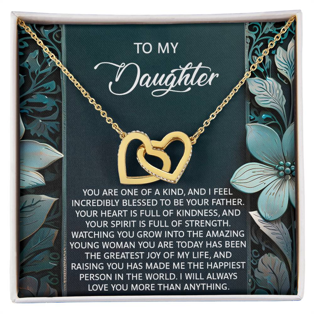 The Daughter-Happiest Person Interlocking Hearts Necklace, featuring sparkling cubic zirconia crystals, is beautifully presented in a gift box with a heartfelt message to your daughter against a floral background.