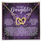 An Interlocking Hearts necklace from the Daughter-Moon Back collection, featuring a rose gold finish and cubic zirconia crystals, is presented in a gift box. The purple butterfly backdrop includes a "To My Daughter" message, expressing love, pride, and always carrying her in the heart.