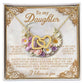 The Daughter-Heart Happiness Interlocking Hearts Necklace comes with a "To my Daughter" card on a floral background, featuring an inspirational message about love and strength along with decorative golden borders and an elegant rose gold finish.