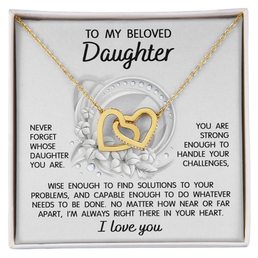 The "To Daughter, Always Right There - Interlocking Hearts Necklace" features a stunning interlocking hearts design with a rose gold finish and sparkling cubic zirconia crystals. It comes in a gift box that includes a heartfelt message for your beloved daughter, offering support, wisdom, and love.