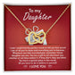 A stunning "To Daughter, A Gift - Interlocking Hearts Necklace" with cubic zirconia crystals is displayed on a red card, featuring a heartfelt message for a daughter, expressing pride, love, and encouragement.