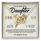 The Daughter-Heavy Tiara necklace in rose gold, featuring interlocking hearts with cubic zirconia crystals, is beautifully presented against a message card adorned with a beige bow, expressing love and support to a daughter.