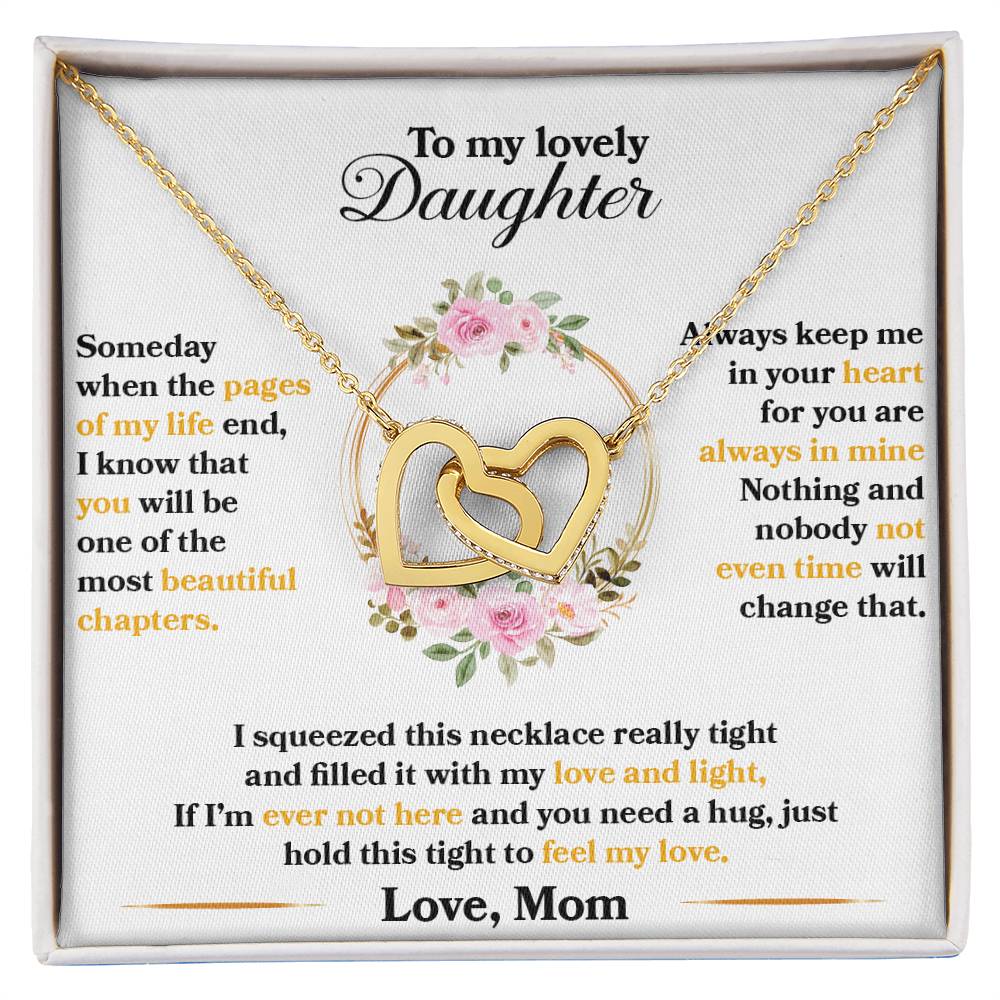 A sentimental anniversary gift message from a mother to her daughter, printed on a card with a "To My Lovely Daughter, Hold This Tight To Feel My Love" Interlocking Hearts Necklace adorned with CZ crystals by ShineOn Fulfillment.
