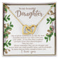 The Daughter-First Smile - Interlocking Hearts Necklace, embellished with cubic zirconia crystals, is presented on a floral card that reads: "To my beautiful Daughter," expressing love and admiration while encouraging strength and bravery.