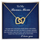The Bonus Mom-I Needed You Interlocking Hearts Necklace features a rose gold finish against a blue backdrop, adorned with cubic zirconia crystals and a heartfelt message of love and gratitude celebrating your unique bond.
