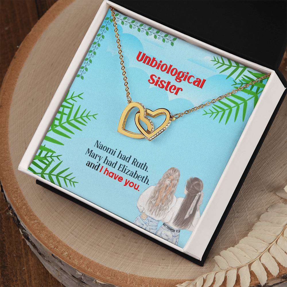 A gift box containing a To My Unbiological Sister, I Have You - Interlocking Hearts Necklace and a message celebrating an unbiological sister relationship by ShineOn Fulfillment.
