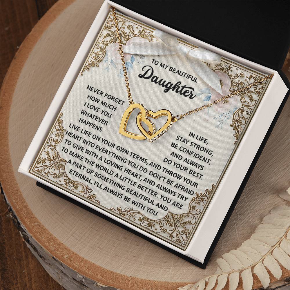 The Daughter-Beautiful And Eternal - Interlocking Hearts Necklace, featuring a rose gold finish and cubic zirconia crystals, comes in an open box with a heartfelt message that encourages love, confidence, and living life on her own terms.