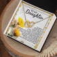 The Daughter-Journey Home Interlocking Hearts Necklace, featuring gold and sparkling cubic zirconia crystals, is beautifully presented in a floral-themed gift box with the message "To My Daughter" and accompanied by a heartfelt love and encouragement note.