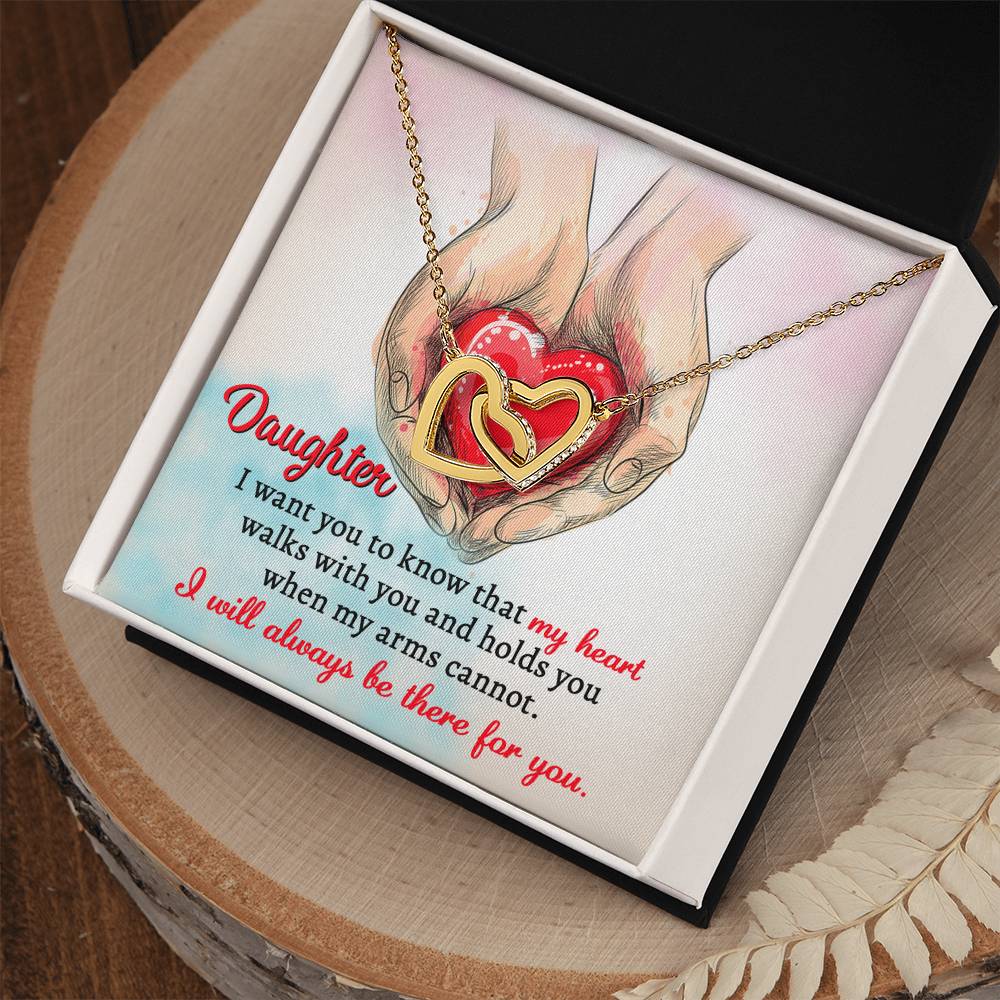 A high quality polished surgical steel necklace with two interlocking hearts is placed over an illustration of hands holding a red heart. Text reads: "Daughter, I want you to know that my heart walks with you and holds you when my arms cannot. I will always be there for you.
Product Name: To Daughter, Always Be There - Interlocking Hearts Necklace.