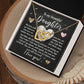 The Daughter-Your Strength Interlocking Hearts Necklace features a rose gold finish and cubic zirconia crystals, packaged in a gift box with a heartfelt message to a daughter about love, strength, and resilience, elegantly scripted on a dark background with heart graphics.