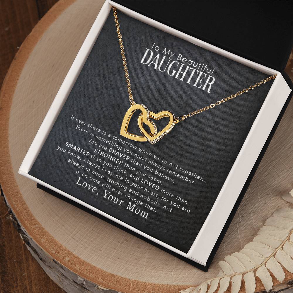 A "To My Beautiful Daughter, You Are Braver Than You Believe" interlocking hearts necklace from ShineOn Fulfillment presented in a gift box featuring a sentimental message to a daughter from a mother.