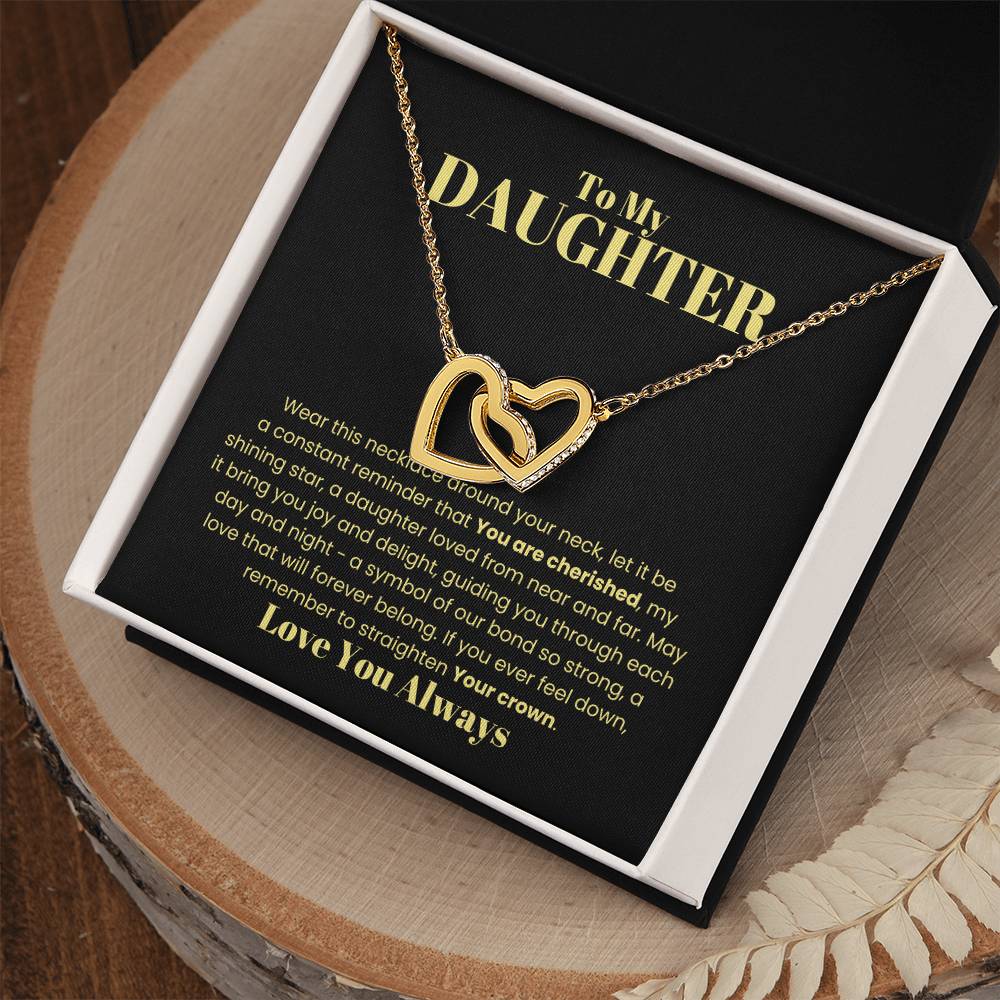 The "[Almost Sold Out] To My Daughter, Wear This Necklace - Interlocking Hearts Necklace," sparkling with cubic zirconia crystals, comes elegantly displayed in a gift box with a touching message celebrating a daughter's never-ending love.