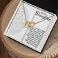 The Daughter-Tomorrow Worry - Interlocking Hearts Necklace features a rose gold finish and is beautifully displayed in a gift box. The box includes a heartfelt daughter message, adorned with delicate cubic zirconia crystals on an elegantly embossed backdrop.