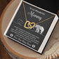 This unique gift, the "To Mama To Be, Until We Meet - Interlocking Hearts Necklace," features cubic zirconia crystals and is displayed on a card with a touching message from an unborn child to "Mommy," alongside a charming adult and baby elephant illustration.