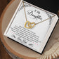 A heart-shaped pendant with a ShineOn Fulfillment To My Daughter, I'm Always Right Here In Your Heart - Interlocking Hearts Necklace design, presented in a box with a loving message from a father to a daughter.