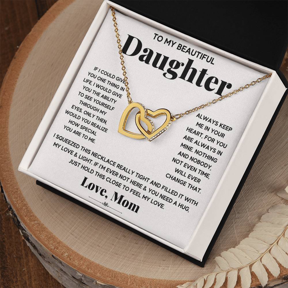 A To My Beautiful Daughter, Just Hold This To Feel My Love - Interlocking Hearts Necklace in a gift box featuring a sentimental message from ShineOn Fulfillment.