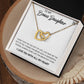 To My Bonus Daughter, Always Shine Like The Brightest Star - Interlocking Hearts Necklace in a gift box with a message from ShineOn Fulfillment.