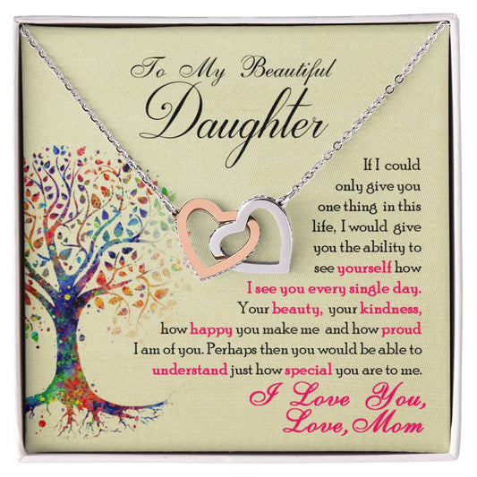 A "To My Beautiful Daughter, You Are Special To Me - Interlocking Hearts Necklace" featuring interlocking hearts adorned with cubic zirconia crystals, presented on a card with a loving message from ShineOn Fulfillment.
