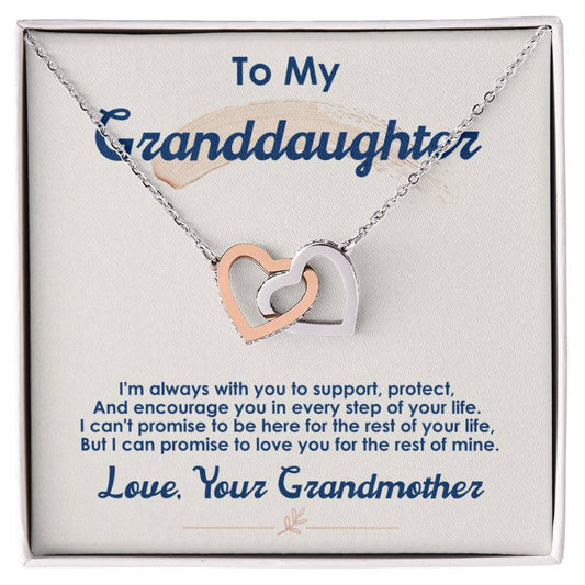 A silver and rose gold ShineOn Fulfillment Interlocking Hearts necklace pendant on a display card with a sentimental message from a grandmother to her granddaughter, designed as an anniversary gift.