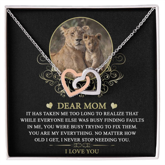 To Mom, My Everything - Interlocking Hearts Necklace with a pendant featuring a lion and cub, displayed on a black background.