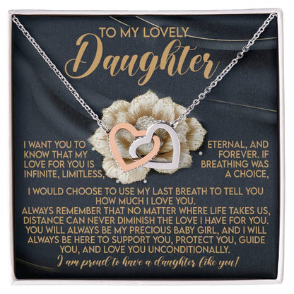 The Daughter-Infinite Love - Interlocking Hearts Necklace features a rose gold finish and cubic zirconia crystals, beautifully displayed over a heartfelt message for a daughter, symbolizing eternal love and support against a delicate flower background.