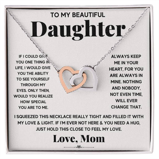 A To My Beautiful Daughter, Just Hold This To Feel My Love - Interlocking Hearts Necklace adorned with cubic zirconia crystals, presented on a card with a sentimental message from ShineOn Fulfillment.