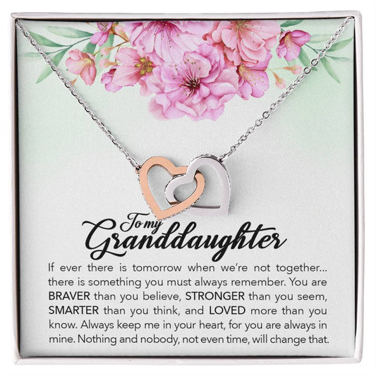ShineOn Fulfillment's "To My Granddaughter, Always Keep Me In Your Heart" Interlocking Hearts Necklace adorned with cubic zirconia crystals, featuring a touching inscription for a granddaughter, presented in a gift box with floral accents.